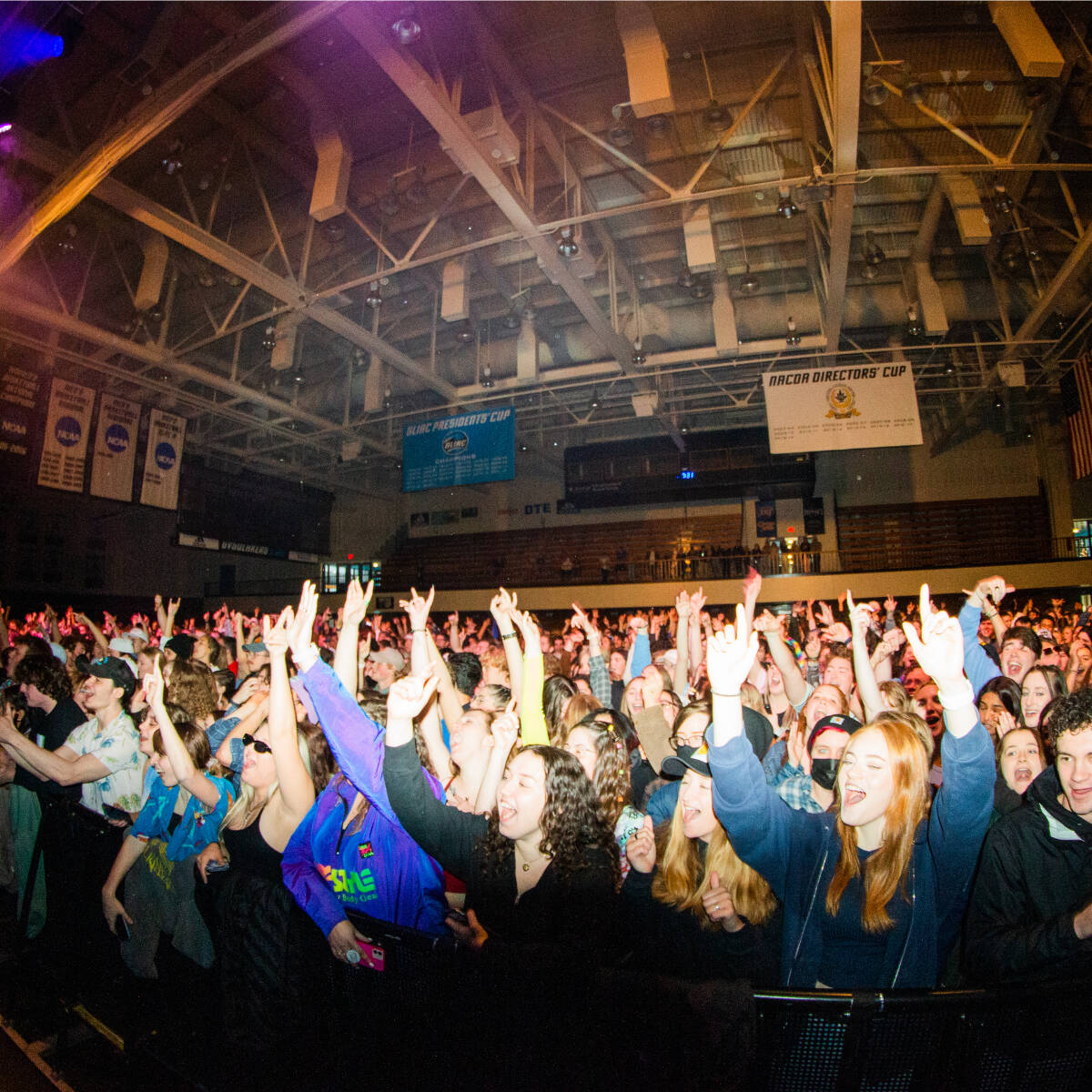 A crowd of students cheering at the Spring Concert in the Fieldhouse Arena